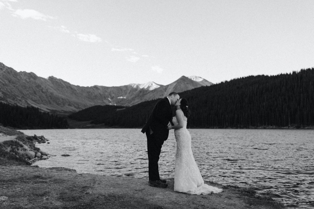 couple sharing their first kiss during their destination elopement ceremony