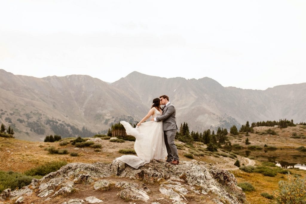 sunrise elopement photos on the top of a mountain