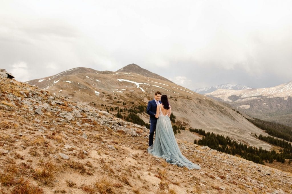 bride and groom standing together in the mountains during their Buena Vista elopement ceremony
