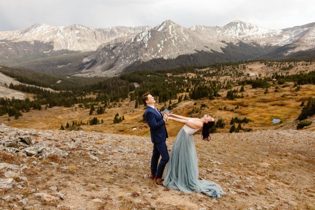 couple screaming in celebration at the sky during their Buena Vista elopement ceremony