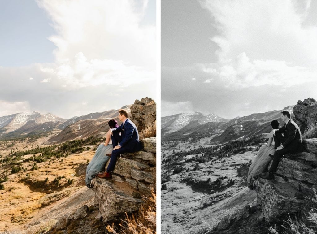 bride and groom sitting together on a cliffside as the wind blows by on their Buena Vista elopement day