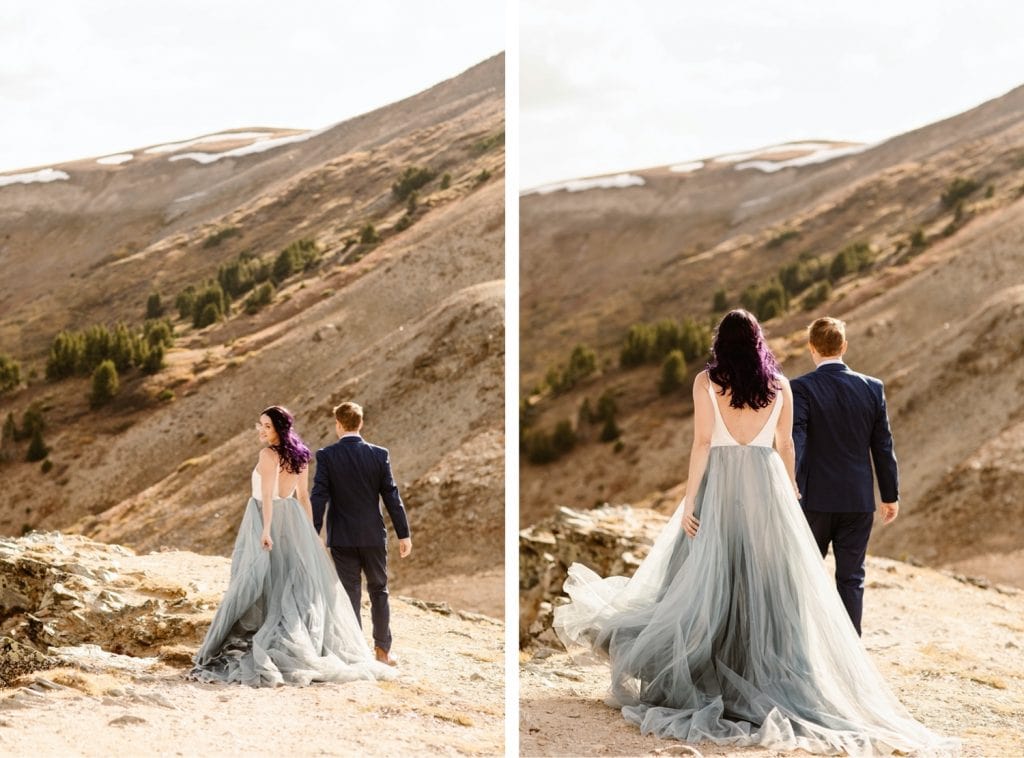 bride and groom hiking down the trail during their Buena Vista elopement