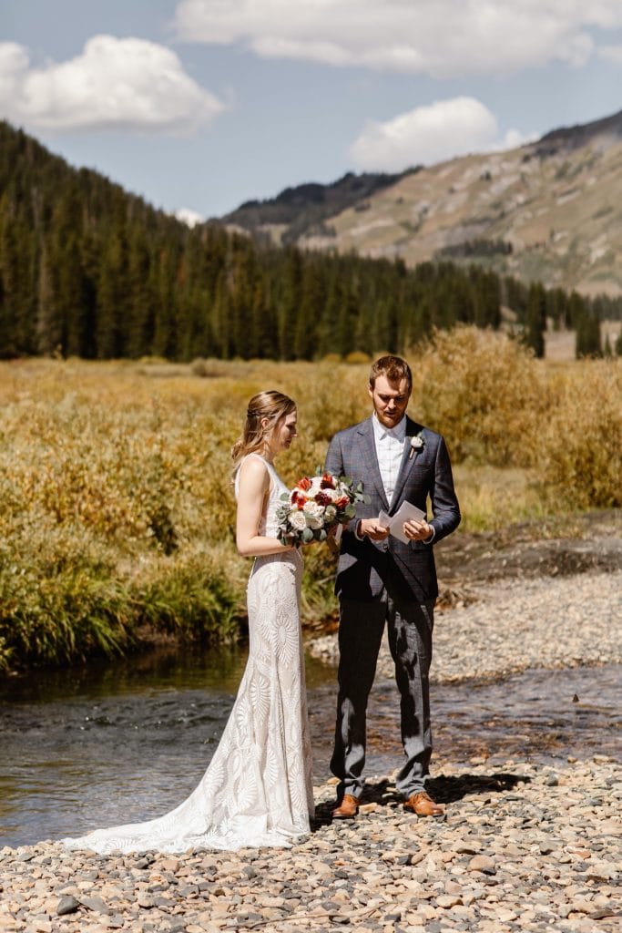 bride and groom reading a poem during their Crested Butte elopement ceremony
