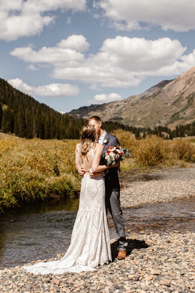 couple sharing their first kiss during their Crested Butte elopement ceremony
