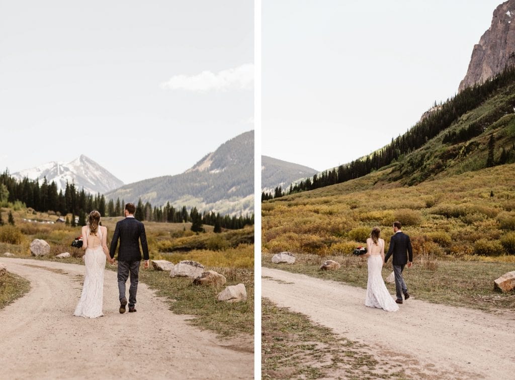 Crested Butte elopement couple running down a dirt road in the mountains