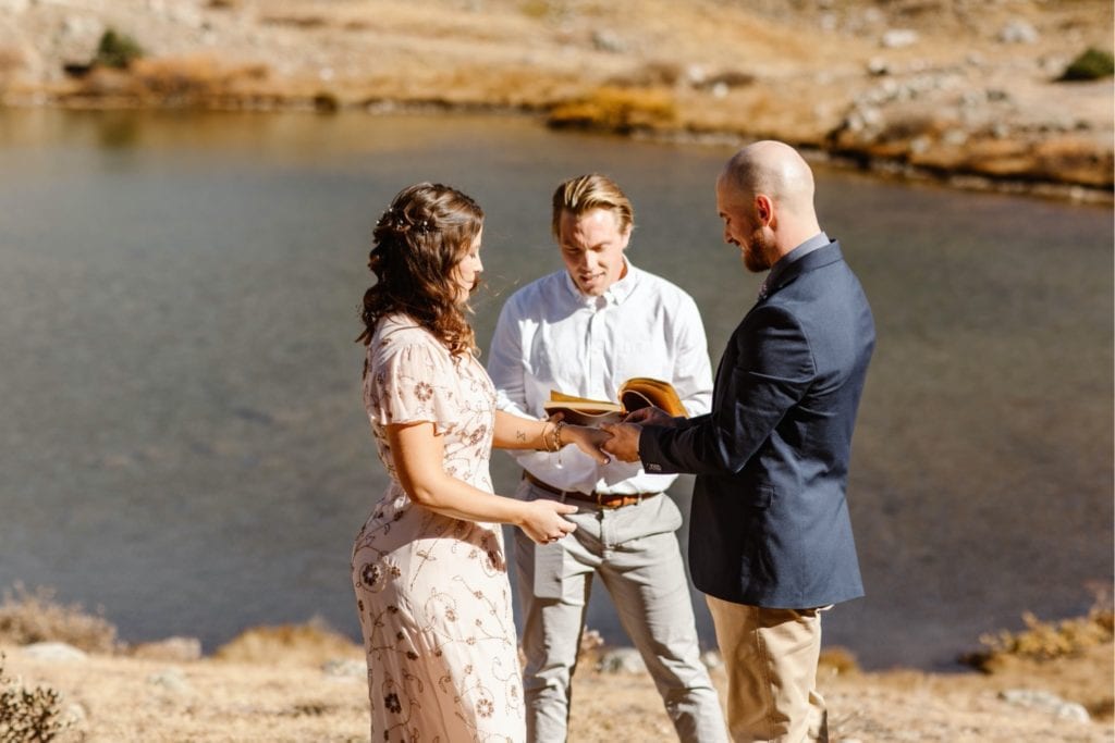 ring exchange during a Colorado micro wedding ceremony