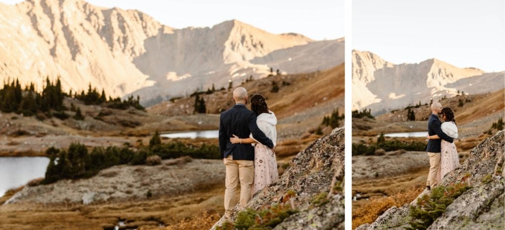 Colorado micro wedding couple standing together and admiring the alpenglow on the mountains at sunset