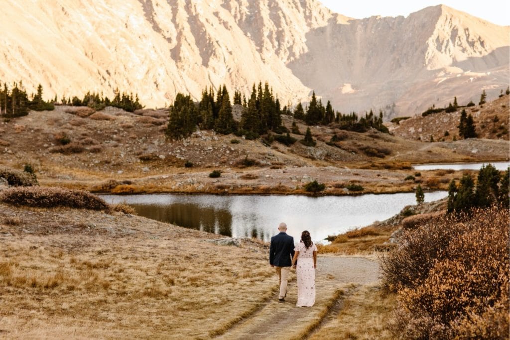 Colorado micro wedding couple dancing on the hiking trail at sunset
