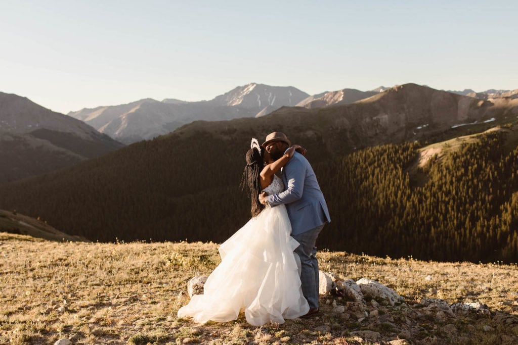 photo of couple getting married on a mountaintop documented by Colorado elopement photographers