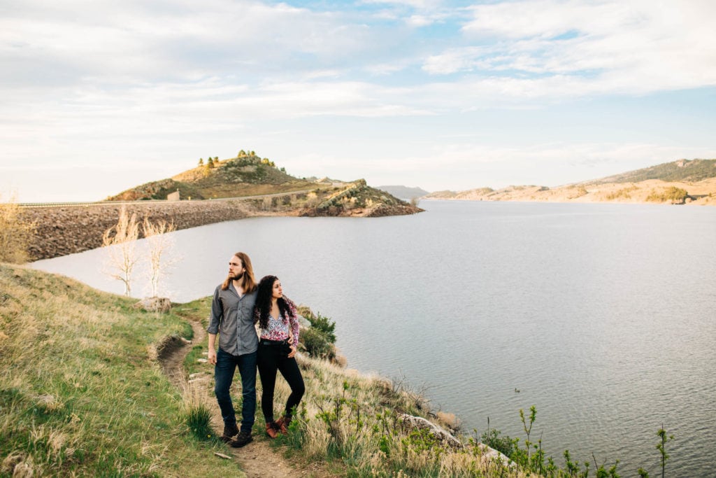 couple standing at Horsetooth Reservoir in Fort Collins during their Colorado road trip