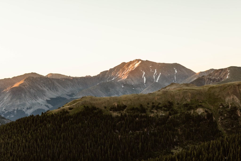 alpenglow sunrise view on a hike near Aspen for a Colorado road trip itinerary