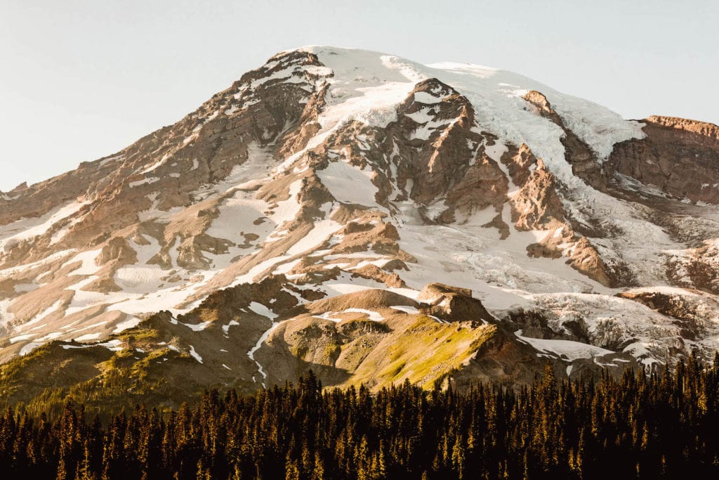 view of Mt Rainier with early alpenglow at sunset on a Washington State road trip in July