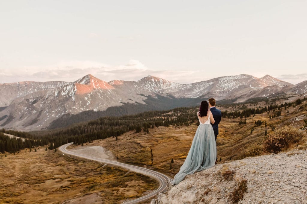 bride wearing a colorful blue chiffon elopement dress for a fall wedding ceremony