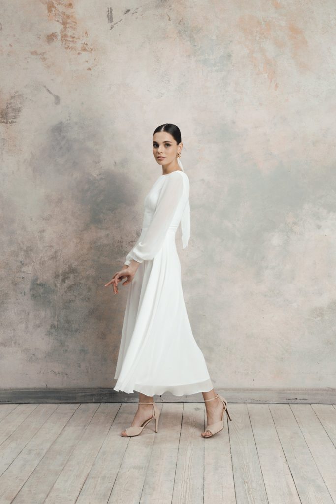 bride wearing a simple ankle length chiffon affordable elopement dress for fall
