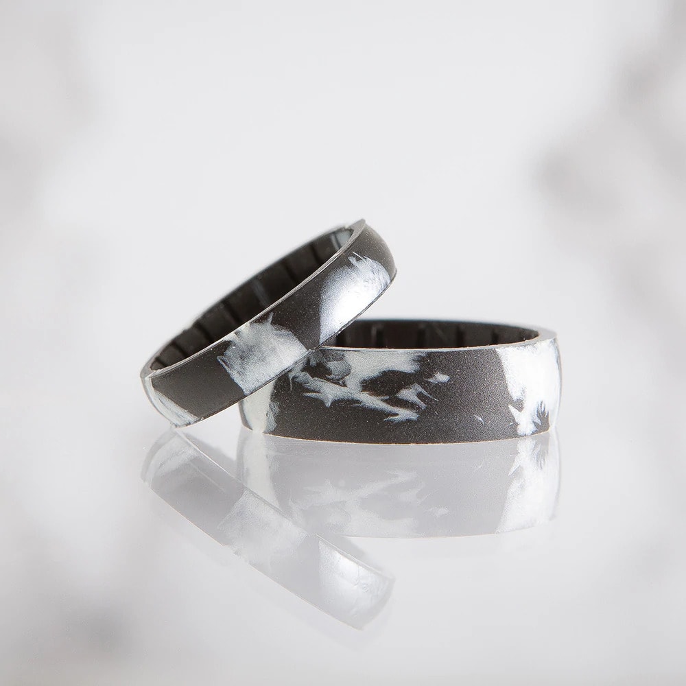 marble patterned best silicone wedding bands stacked on one another