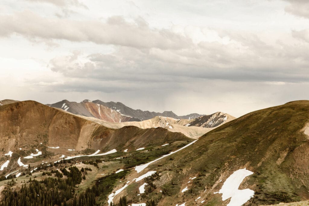 layers of snow dotted mountains on Independence Pass in central Colorado