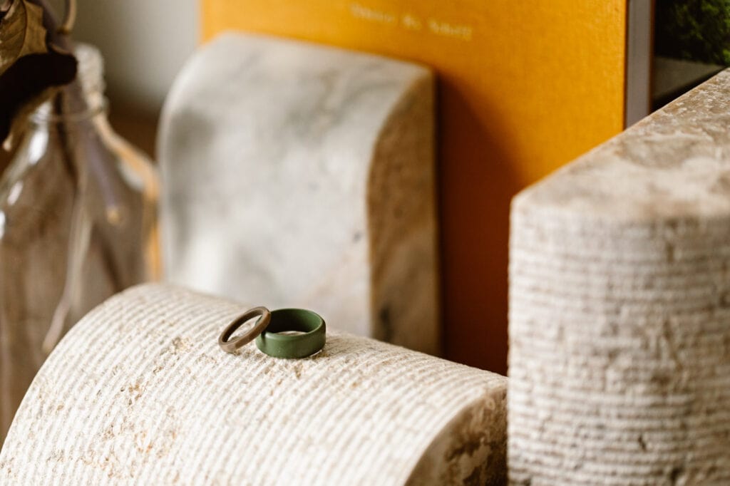 womens and mens best silicone wedding bands in olive green stacked next to one another
