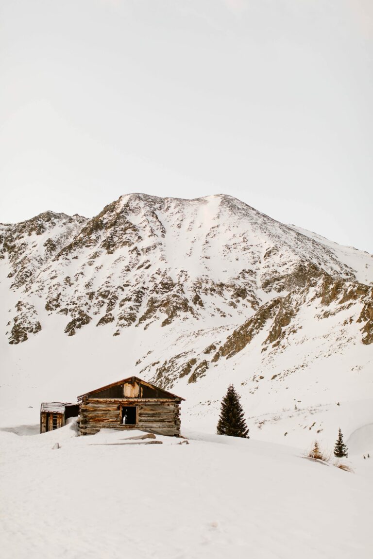 Boston mine cabins in the snow along Mayflower Gulch Trail Colorado