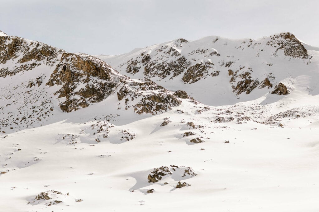 snow covered mountainside views alongside Mayflower Gulch Trail in Colorado during the winter