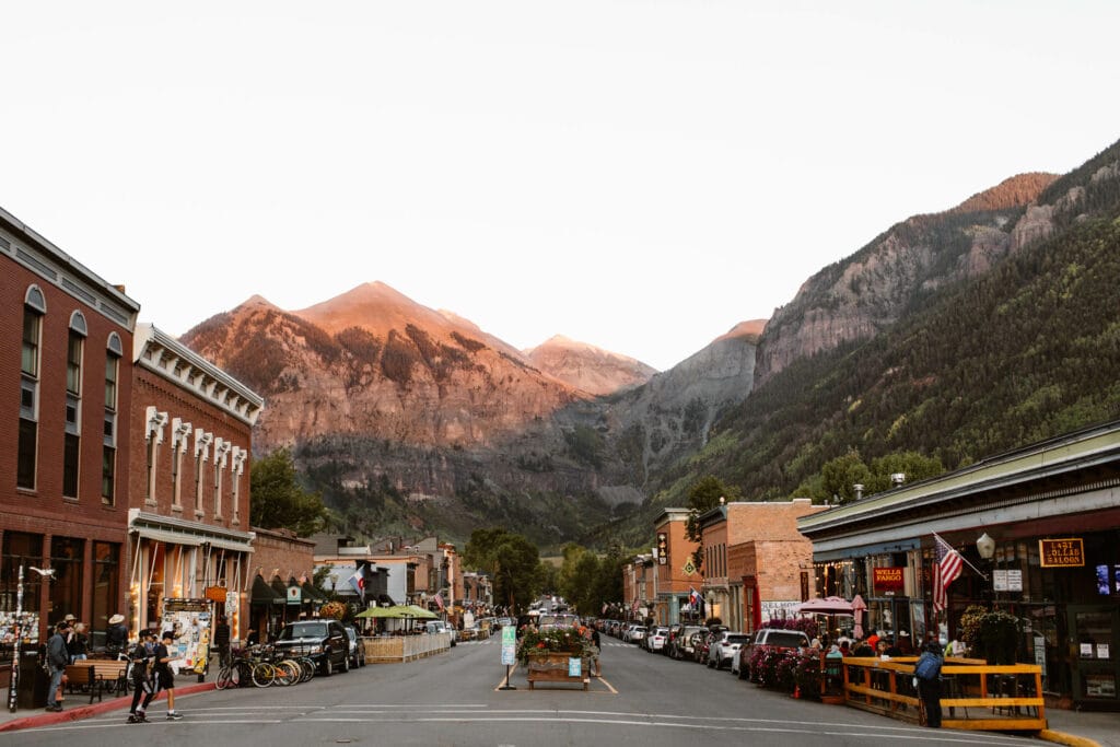 view of downtown Telluride at sunset showing what it is like living in Colorado in the warmer seasons