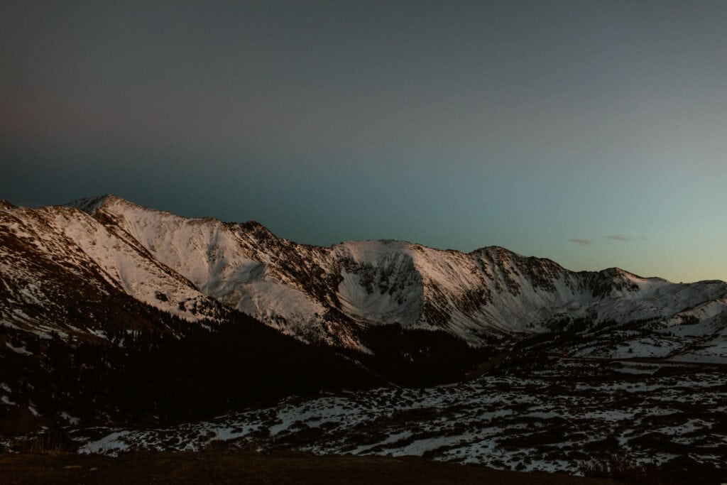 snow covered mountains on Loveland Pass on a cold winter night