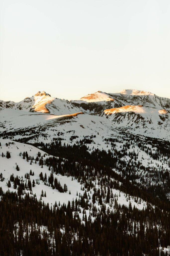 alpenglow on the tips of snow mountains you can see from the Continental Divide overlook on Loveland Pass in Colorado