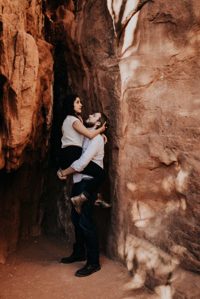 a couple who moved and is now living in Colorado exploring the red rock formations in Garden of the Gods