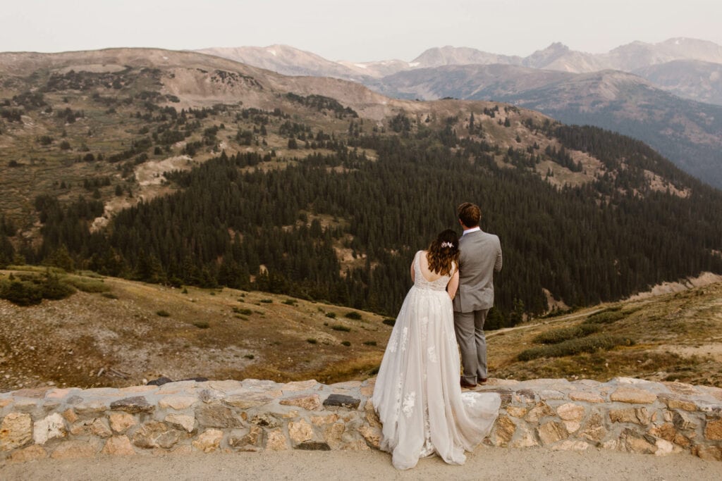 couple standing together during their elopement on Loveland Pass in the summer