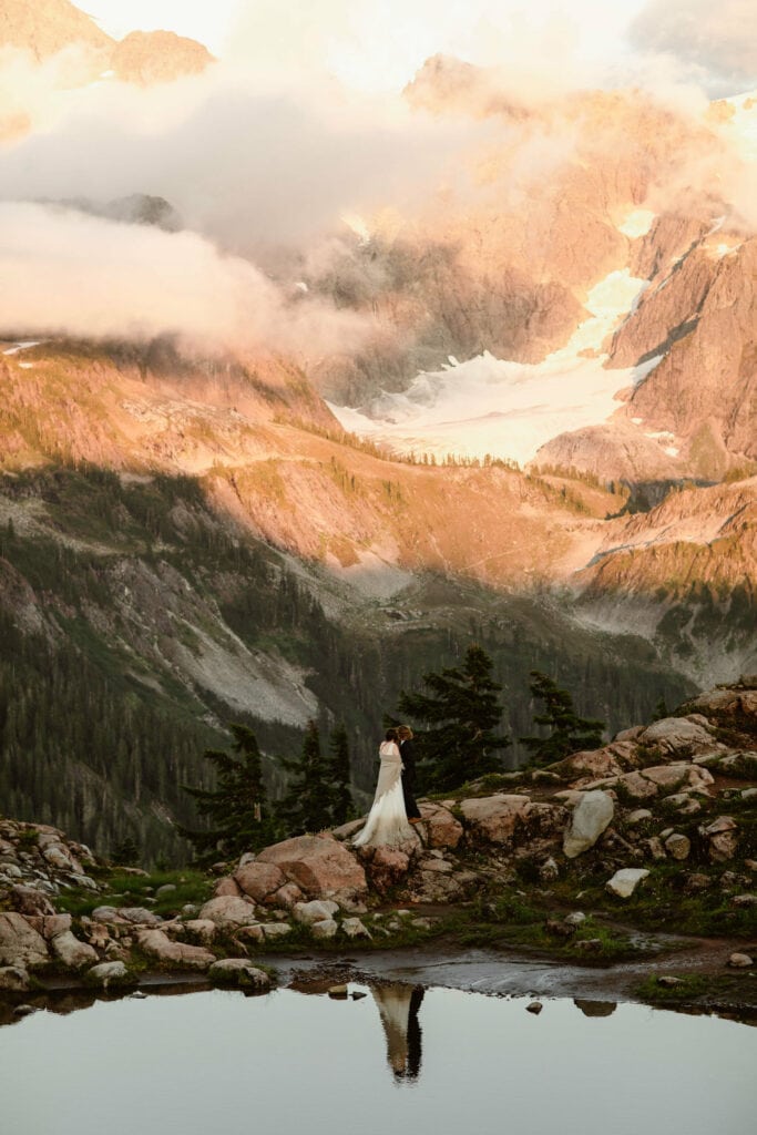 couple eloping at Artist Point in Washington on a summer evening with Mount Shuksan behind them