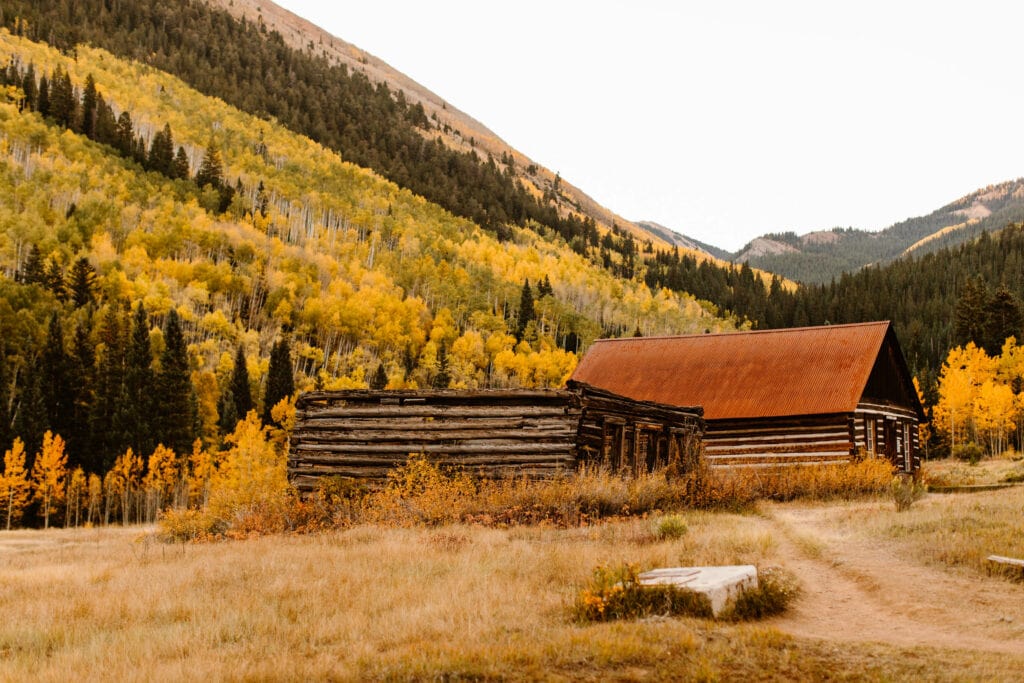 a log cabin and a saloon in Ashcroft Ghost Town near Aspen CO