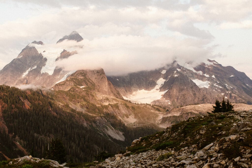 Mt Shuksan at sunset on a summer day surrounded by clouds at Artist Point Mt Baker in Washington state
