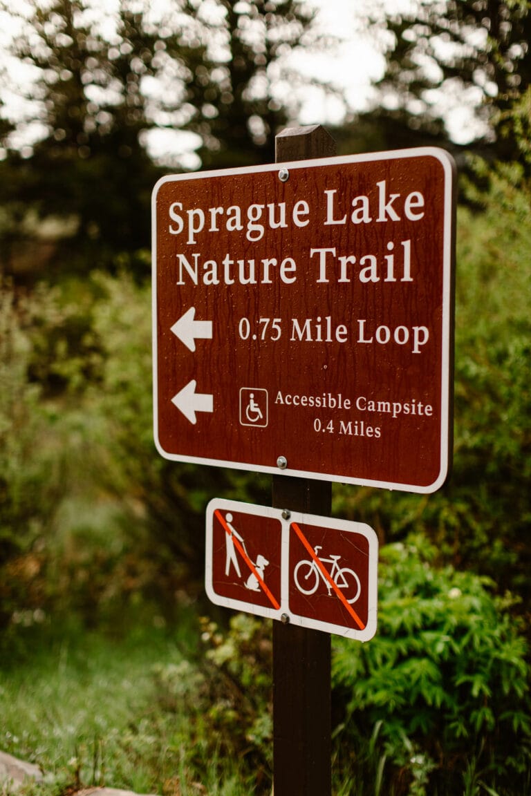 brown sign for Sprague Lake Nature Trail that states that it is a 0.75 mile loop