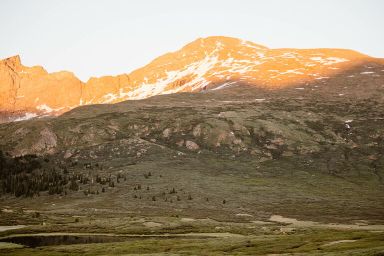 alpenglow on a snow dotted Mt Bierstadt as seen from Guanella Pass Scenic Byway