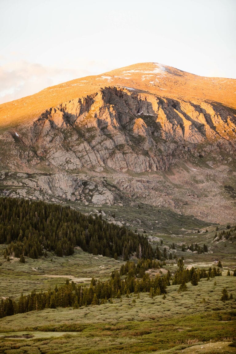 alpenglow on the mountains seen from the Mt Bierstadt trailhead along Guanella Pass Scenic Byway